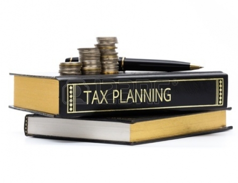 gallery/attachments-Image-17872514-tax-planning-book-with-coins-and-pen-isolated-on-white
